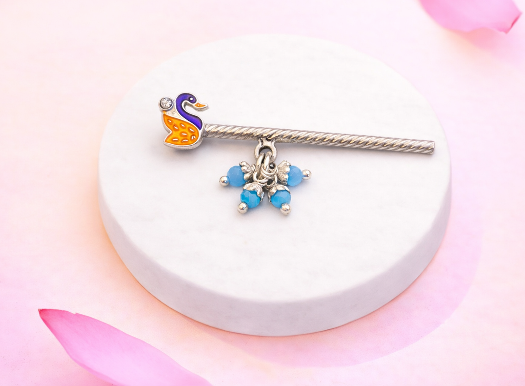 Swan-shaped silver flute with beads