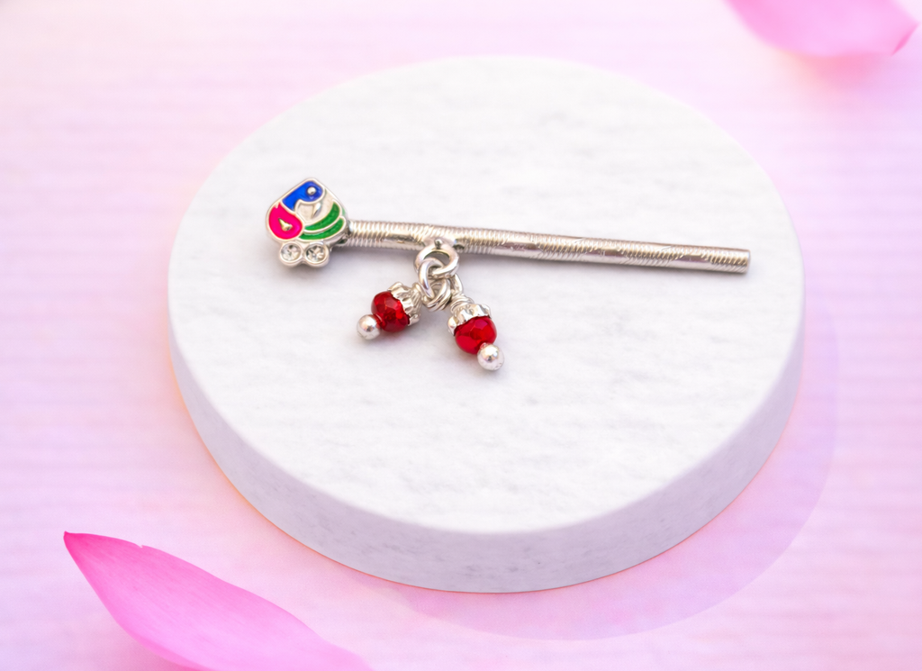 Elegant silver flute with peacock and red beads