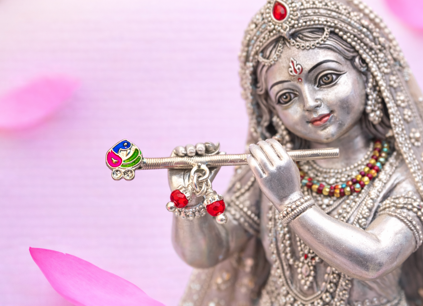 Elegant silver flute with peacock and red beads